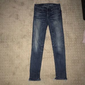Darker wash jeans with a bit of distressed